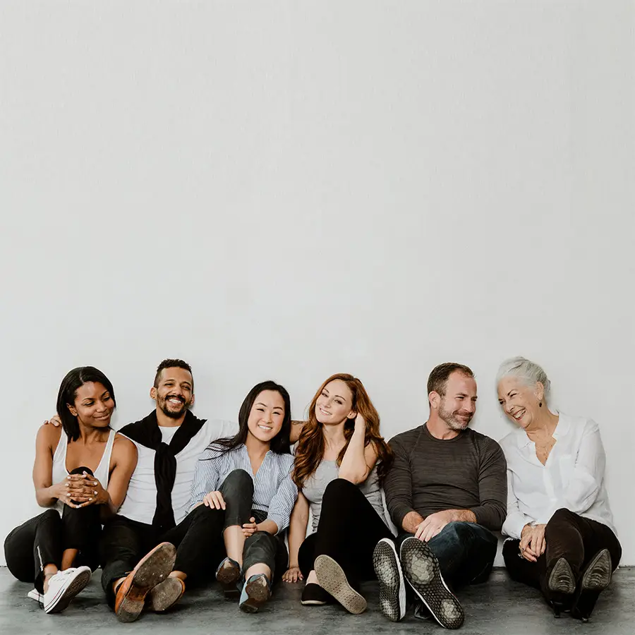 group-of-cheerful-diverse-people-sitting-on-a-floo-JL4PTXB